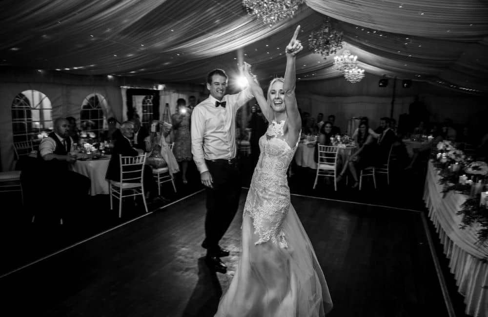 Newlyweds having fun on the dance floor. 