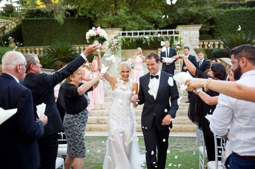 The newlyweds showered in petals after the ceremony. 