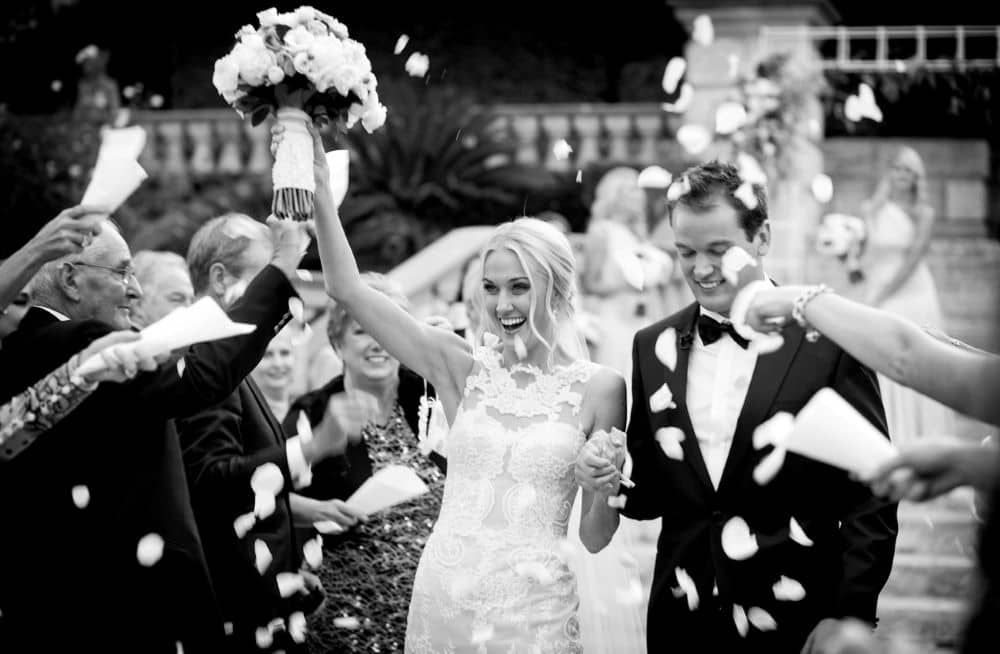 The newlyweds showered in petals after the ceremony. 