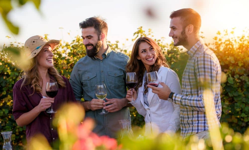 Group of friends enjoying a wine tasting trip.